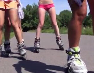 A gang of bare little girls flips on rollers sans underpants
