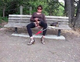 Ultra-cute crossdresser jacks it on a park bench